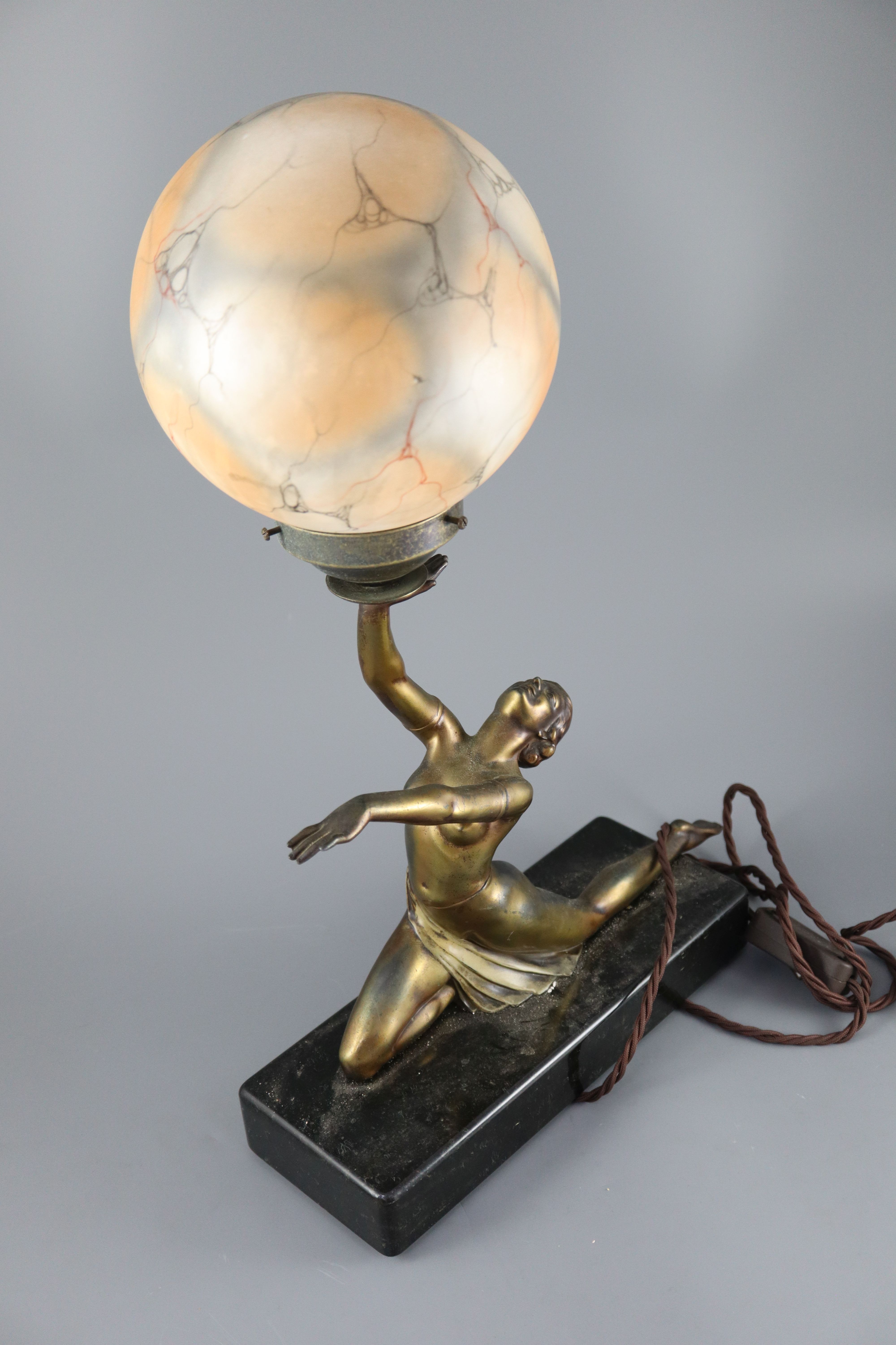 A French Art Deco bronzed spelter table lamp, height 21in.